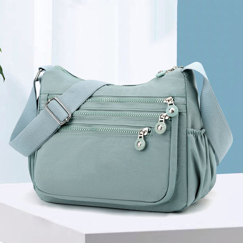 Lichtgewicht nylon crossbodytas met meerdere vakken